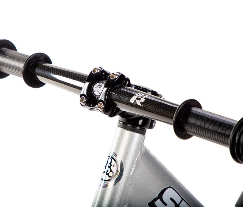 Studio image of silver 12 Pro with Strider ST-R Carbon Fiber Handlebar - close-up angled view