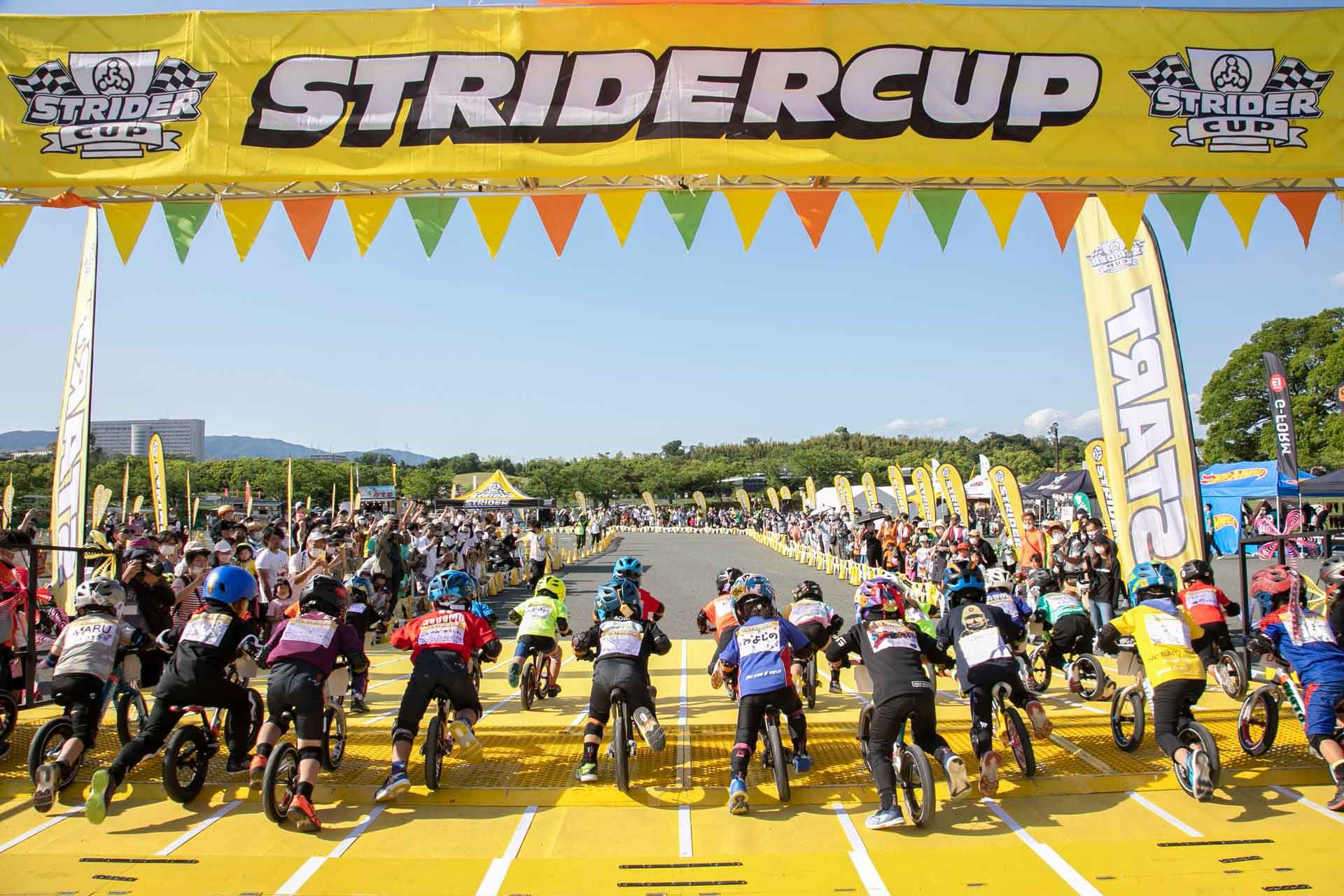riders leave the gate at a Strider Cup balance bike race