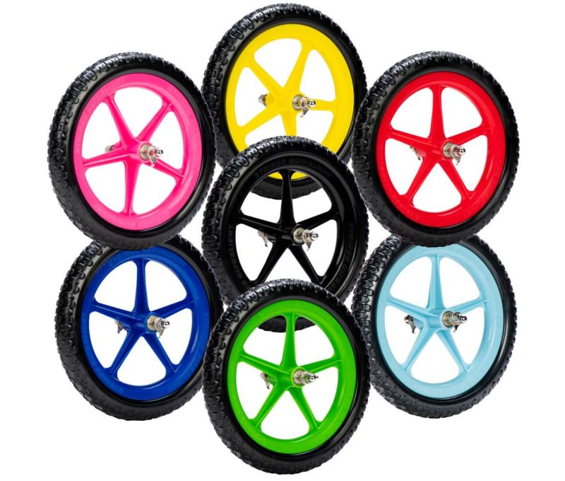 Studio shots of all seven available colors of Strider Ultralight Wheels arranged in a circle