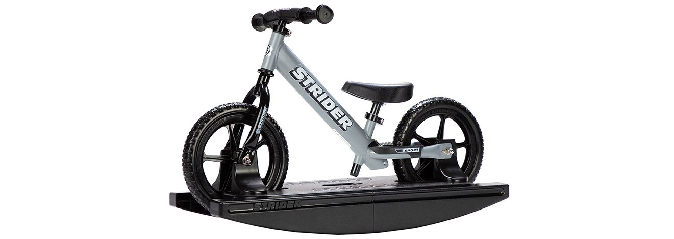 Studio image shot from a slight angle of the Strider 12 Sport 2-in-1 Rocking Bike in Matte Gray color