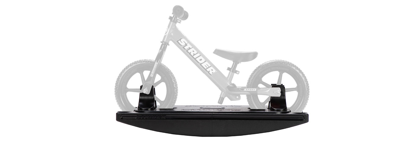 The Strider 2-in-1 Rocking Base with a grayed-out bike