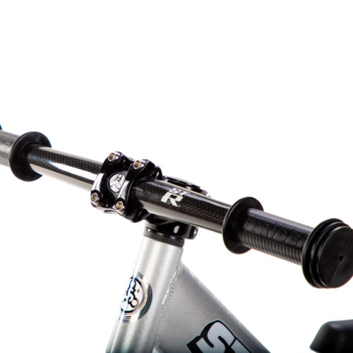 Studio image of silver 12 Pro with Strider ST-R Carbon Fiber Handlebar - close-up angled view