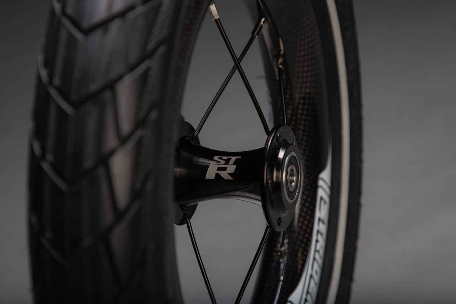 Closeup of Strider ST-R Wheel on dark studio background