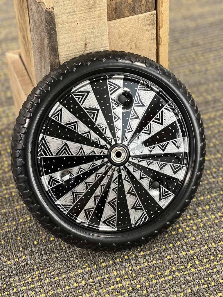 Strider Disc Wheel Cover decorated with permanent marker